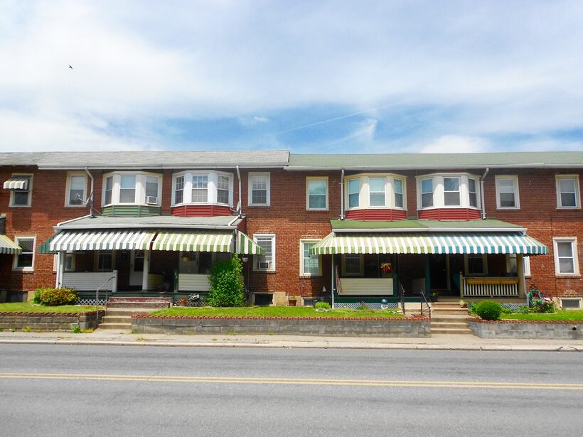 Two apartment buildings on a quiet residential street