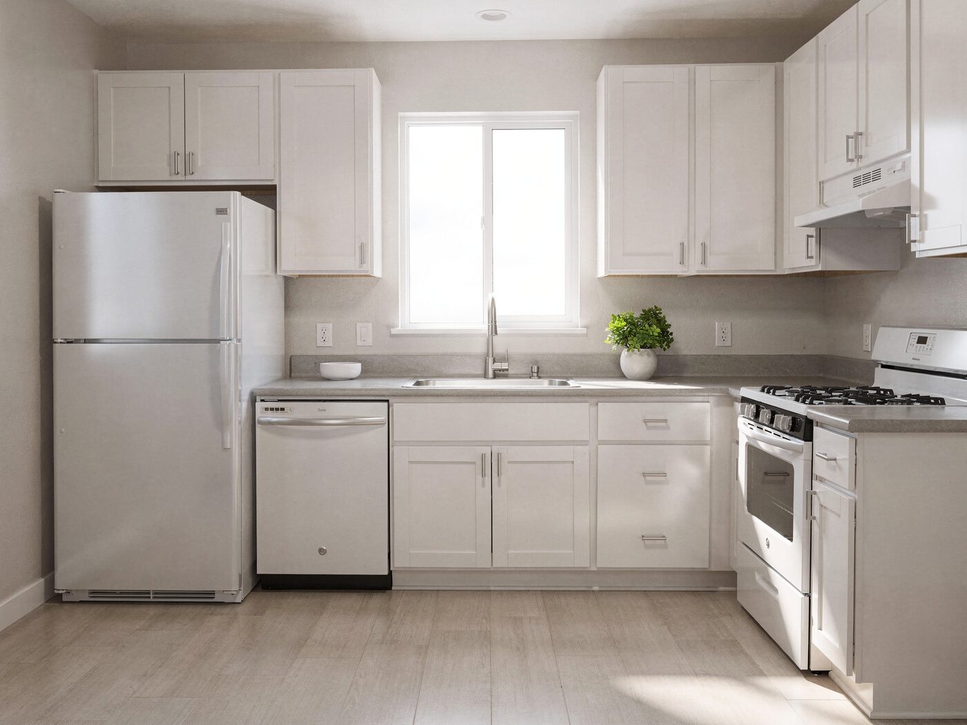 Kitchen with white cabinets and full appliances